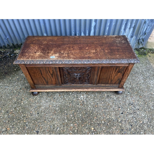82 - A carved oak blanket box chest 116x44x60