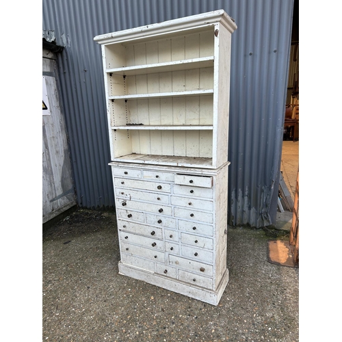 86 - An antique painted  pine chest of drawers with shelving top (base measures) 94x32x106