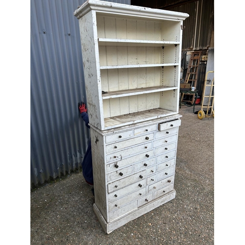 86 - An antique painted  pine chest of drawers with shelving top (base measures) 94x32x106