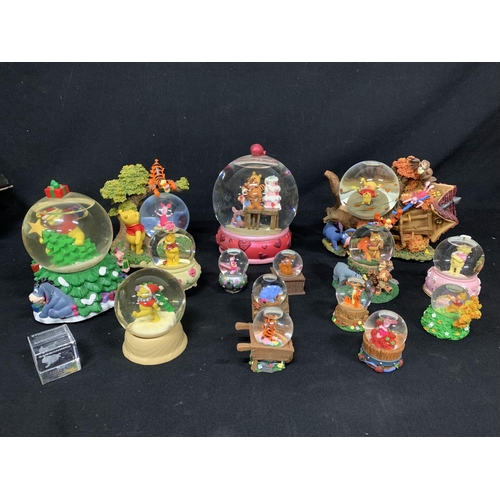 410 - Collection of 15 Disney Winnie the Pooh snow globes and crystal Paperweight