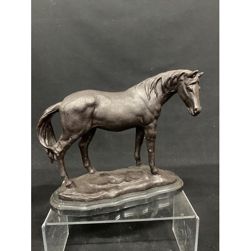 434 - Bronze horse on marble effect plinth, overall length 25cms, height 22cms