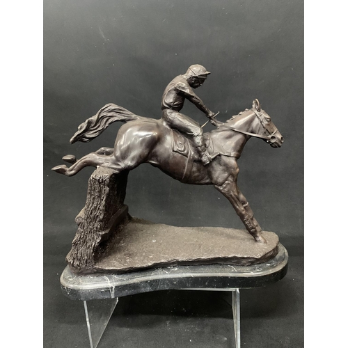 435 - Bronze horse and jockey figure on marble effect plinth, overall length 36cms, height 33cms