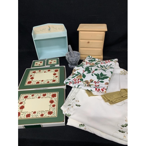 584 - Christmas table cloths and 12 matching table mats and coasters, together with pestle and mortar, sma... 