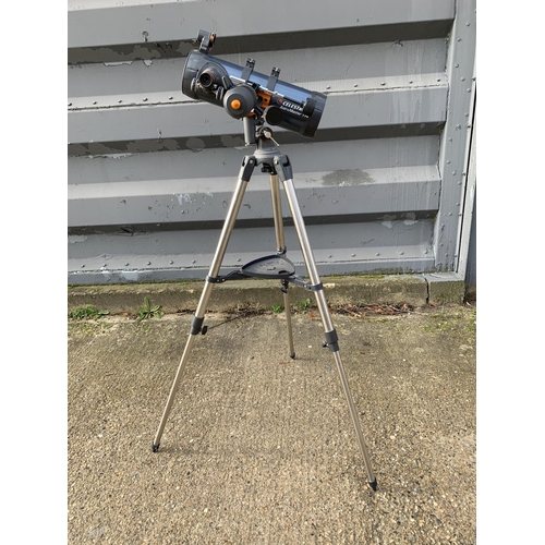 612 - Celestron Astromaster 114 Telescope on Tripod with CD's and instructions