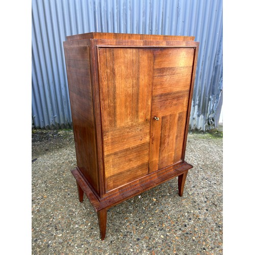 185 - A french mahogany cupboard with adjustable shelves to the interior70x40x120