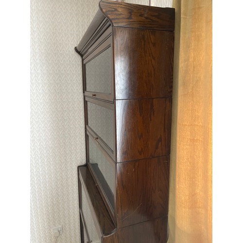 245B - An early 20th century oak five section stacking bookcase, possibly by GLOBE WERNICKE but not labelle... 