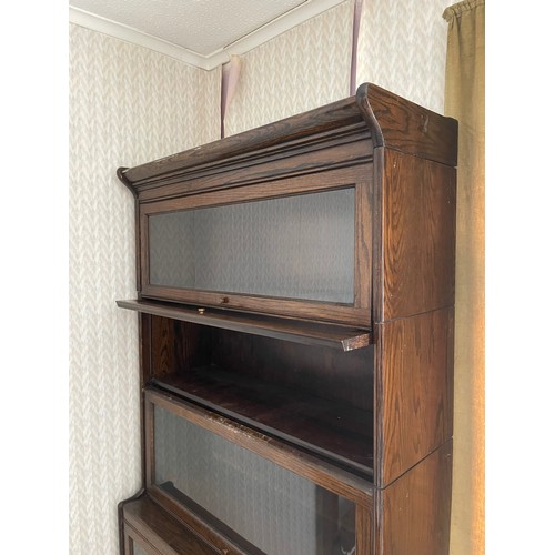 245B - An early 20th century oak five section stacking bookcase, possibly by GLOBE WERNICKE but not labelle... 