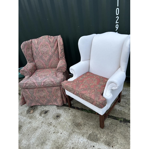 256 - A pair of good quality wing back armchairs with removable loose covers