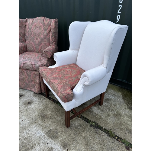 256 - A pair of good quality wing back armchairs with removable loose covers