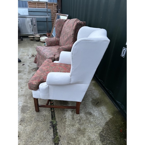 256 - A pair of good quality wing back armchairs with removable loose covers