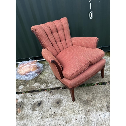 257 - A red upholstered button back armchair