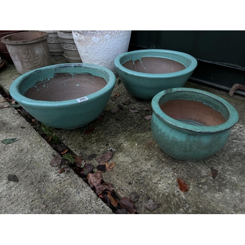 259 - Three green glazed garden pots