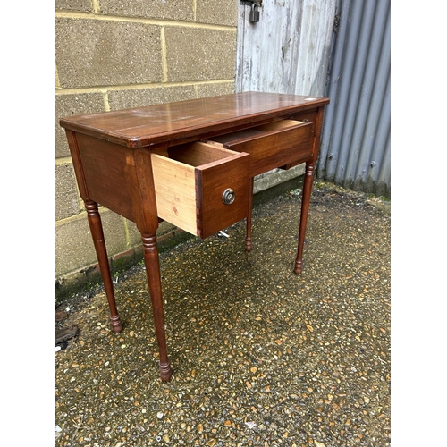 105 - A mahogany four drawer ladies writing table 83x38x77