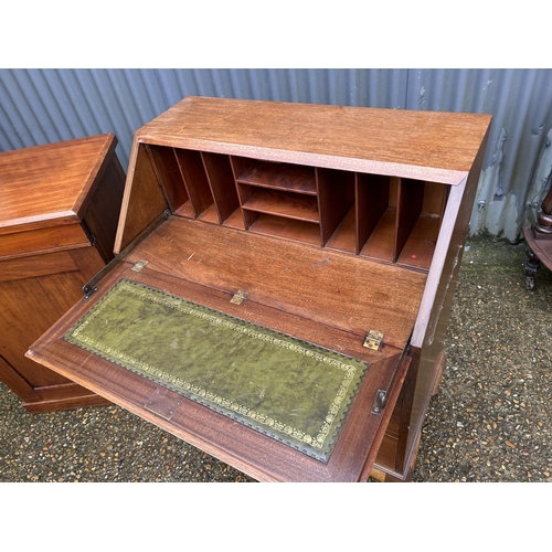 106 - A mahogany bureau together with a Victorian cabinet washstand