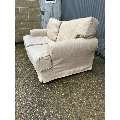 112 - A hessian upholstered two seater sofa