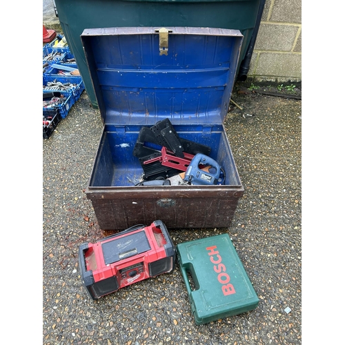126 - A vintage tin trunk containing assorted tools