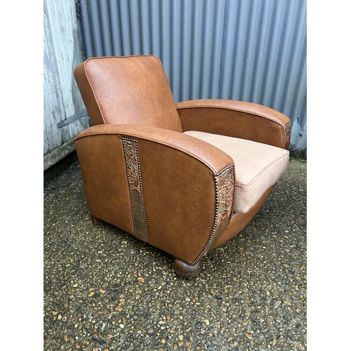 128 - A pair of art deco style oak and brown vinyl armchairs