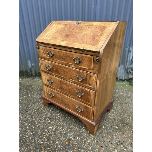 160 - A slim walnut bureau with fitted interior