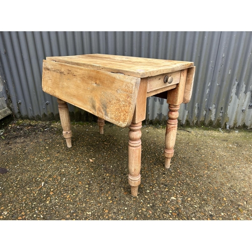 163 - A  farmhouse pine drop leaf table with drawer 90x45