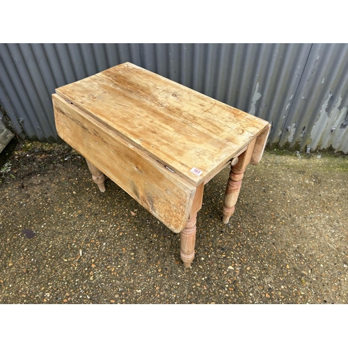 163 - A  farmhouse pine drop leaf table with drawer 90x45