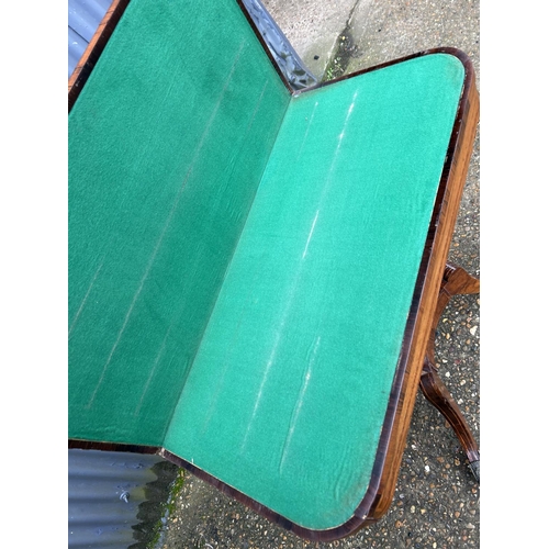 167 - A Victorian mahogany fold over card table with green baize playing surface