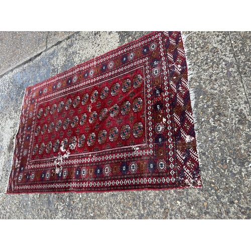 178 - Two worn oriental rugs (both 135x185)