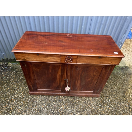 186 - A continental mahogany two drawer and two door sideboard 109x47x92