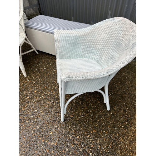 189 - Two Lloyd loom chairs and a loom style white ottoman