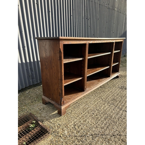 2 - A reproduction oak open fronted bookcase 206x50x95