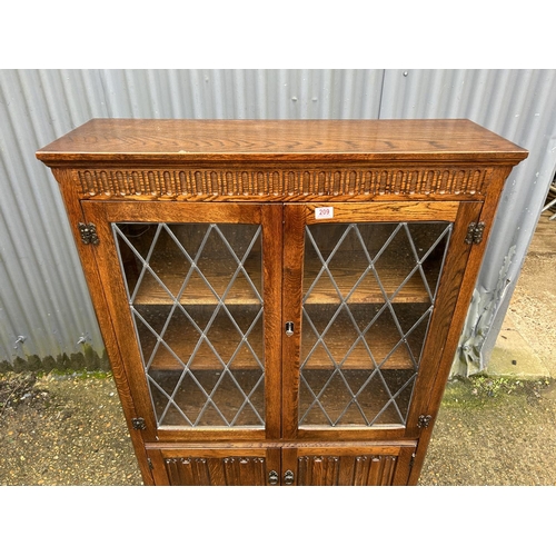 209 - An old charm style leaded oak glazed bookcase 97x32x135