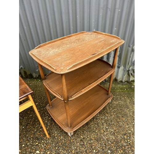 211 - An Ercol tea trolley together with a retro coffee table