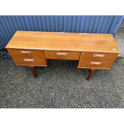 227 - A mid century teak kneehole desk 150x40x75