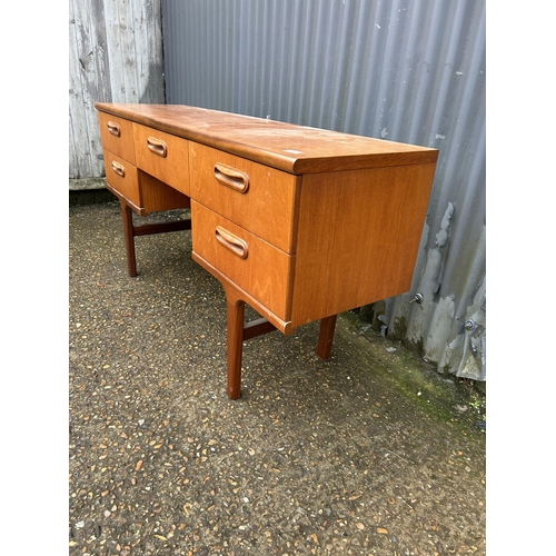 227 - A mid century teak kneehole desk 150x40x75