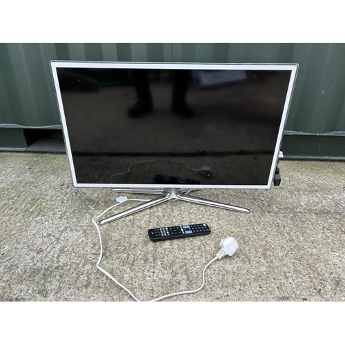 269 - A white Samsung 32 inch TV with one for all remote together with LG screen