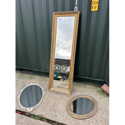 274 - A long gold gilt framed dressing mirror together with a circular mirror and a white french style orn... 