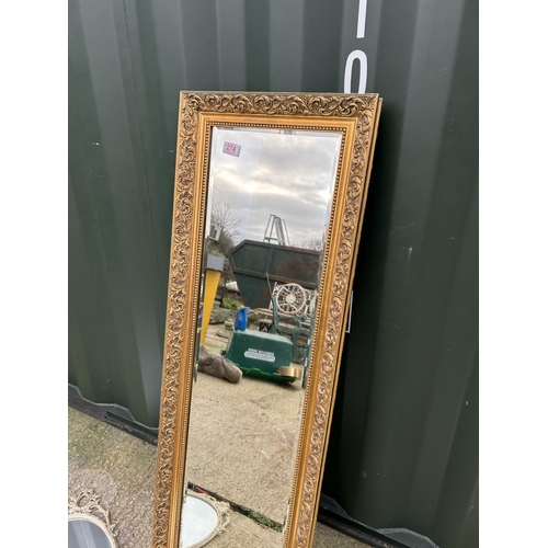 274 - A long gold gilt framed dressing mirror together with a circular mirror and a white french style orn... 