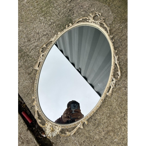 274 - A long gold gilt framed dressing mirror together with a circular mirror and a white french style orn... 