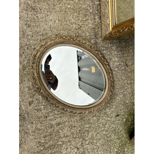 274 - A long gold gilt framed dressing mirror together with a circular mirror and a white french style orn... 