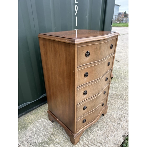 286 - A reproduction serpentine tallboy chest of five drawers 54X44X95