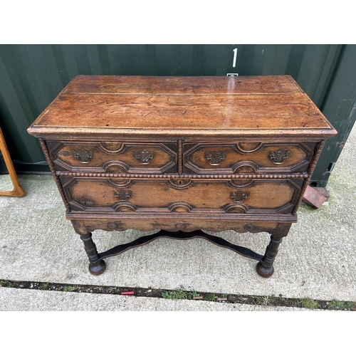 288 - A large antique oak chest of three drawers with cross stretcher base 110x56x100