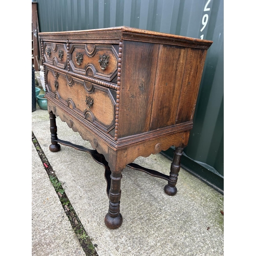 288 - A large antique oak chest of three drawers with cross stretcher base 110x56x100