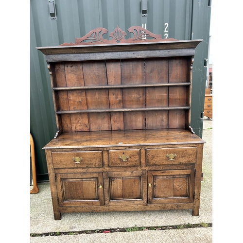 290 - An antique oak three drawer and three door dresser with removable platerack top 163x45x181