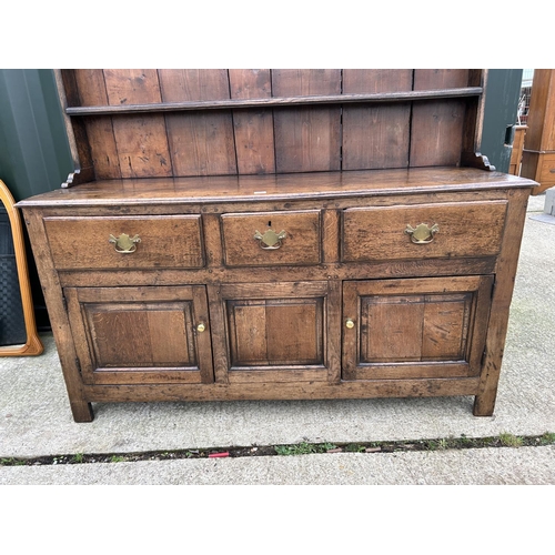 290 - An antique oak three drawer and three door dresser with removable platerack top 163x45x181