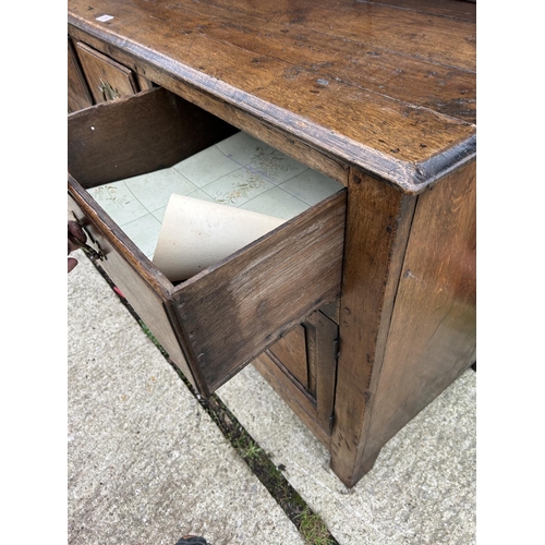 290 - An antique oak three drawer and three door dresser with removable platerack top 163x45x181