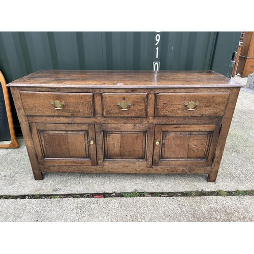 290 - An antique oak three drawer and three door dresser with removable platerack top 163x45x181