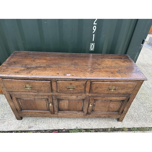 290 - An antique oak three drawer and three door dresser with removable platerack top 163x45x181