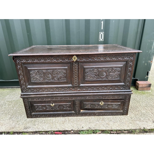 300 - An antique carved oak two section Mule Chest 125x62x77