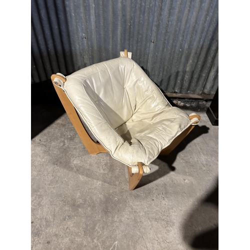 31 - A Danish style cream leather and beech armchair