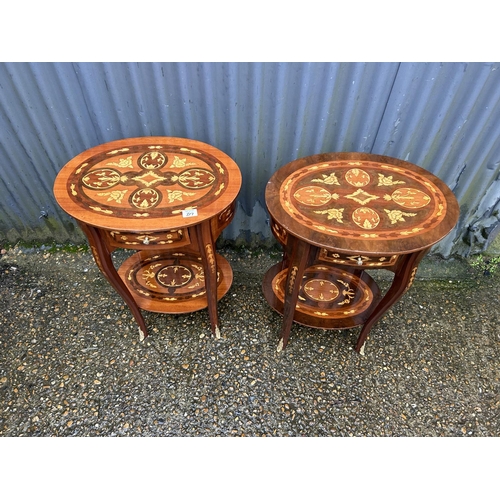 317 - A near pair of Italian style inlaid single drawer oval bedsides with gold gilt mounts