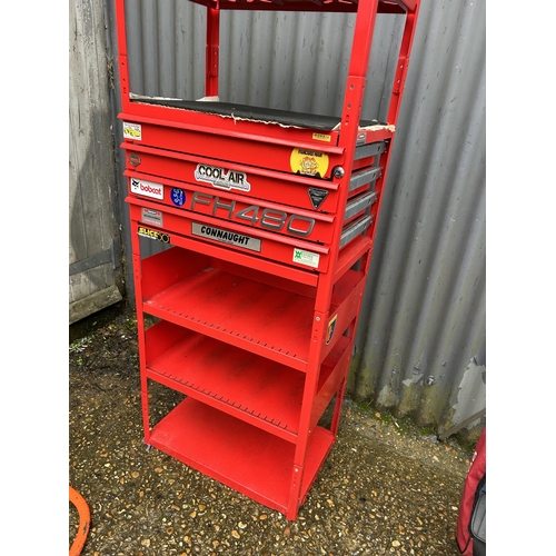 329 - A red workshop shelving unit fitted with three drawers, one drawer fitted with spanner set